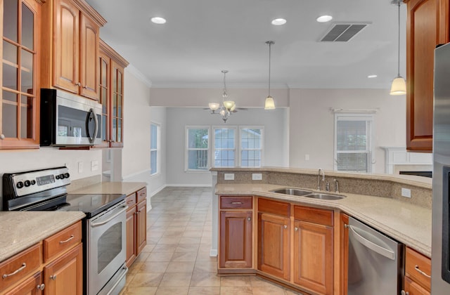 kitchen featuring decorative light fixtures, an inviting chandelier, stainless steel appliances, sink, and light tile floors