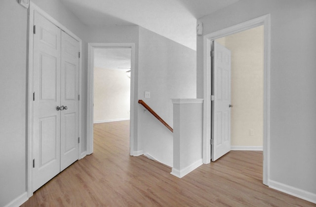 corridor featuring light hardwood / wood-style floors