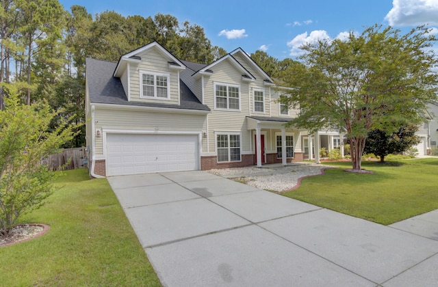 view of front of property with a front yard and a garage