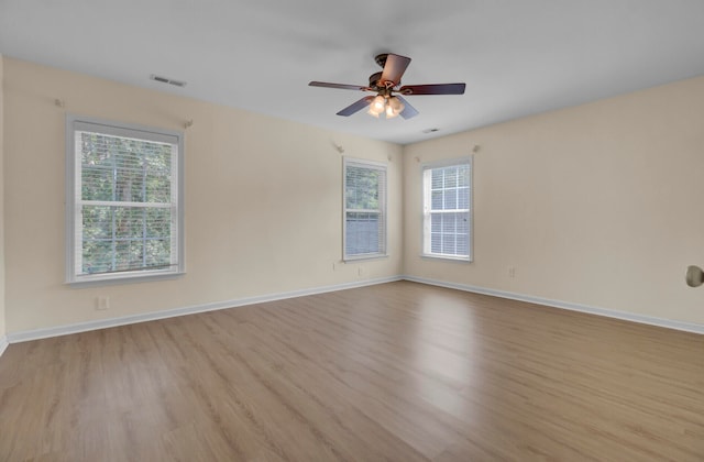 spare room featuring ceiling fan and light wood-type flooring