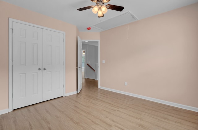 unfurnished bedroom with a closet, ceiling fan, and light wood-type flooring