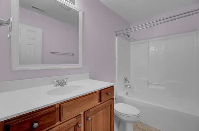 full bathroom with shower / bath combination, tile flooring, vanity, and toilet