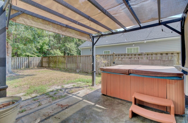 view of patio with a pergola and a hot tub