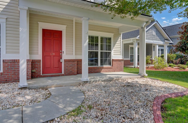 doorway to property with a porch