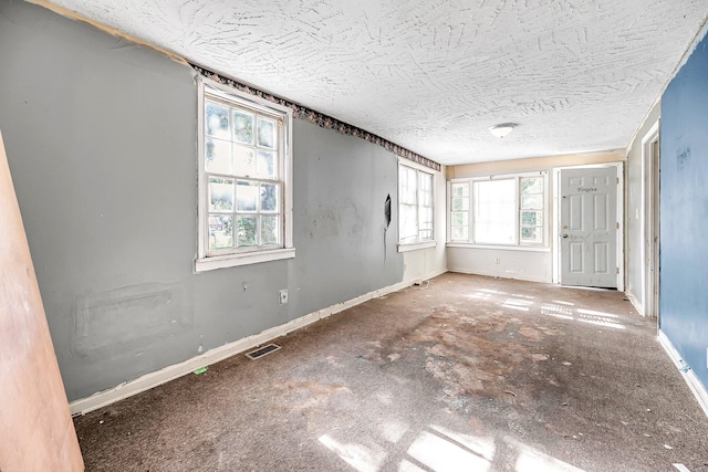 empty room featuring a wealth of natural light