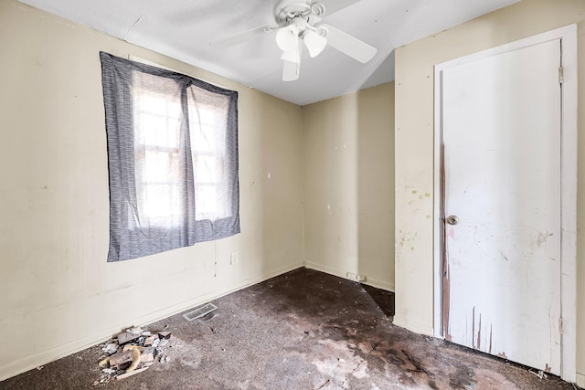 unfurnished room featuring ceiling fan