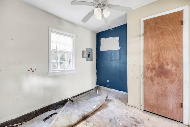 unfurnished room featuring electric panel and ceiling fan