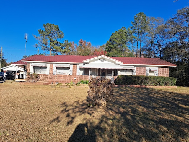 ranch-style house with a front lawn