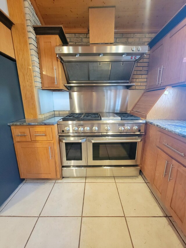 400 Murray Blvd, Summerville, SC 29483 - kitchen with double oven range, brick wall, light tile patterned floors, and range hood