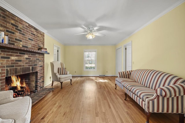 305 Whitewood Ct, Moncks Corner, SC 29461 - living area with wood finished floors, a brick fireplace, ceiling fan, ornamental molding, and baseboards