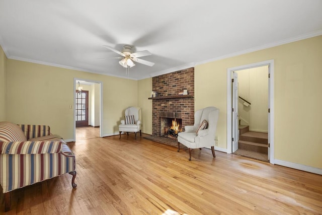 305 Whitewood Ct, Moncks Corner, SC 29461 - living area with ceiling fan, light wood-style flooring, a brick fireplace, stairs, and baseboards