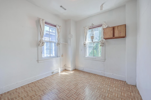 spare room with light parquet flooring