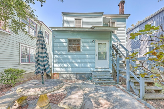 rear view of property featuring a patio