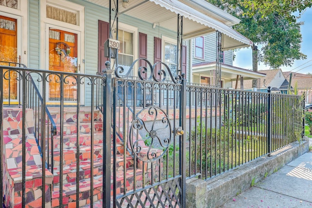 view of gate with covered porch