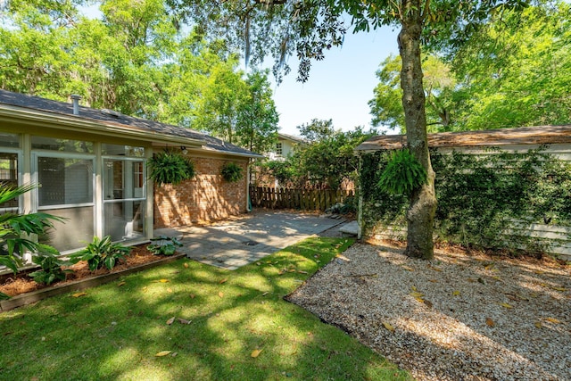 view of yard with a patio area and fence