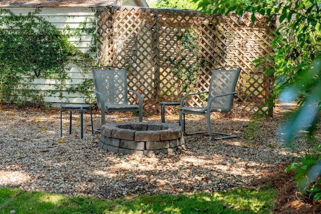view of yard with an outdoor fire pit