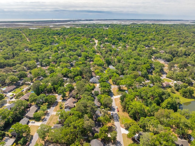 bird's eye view with a forest view and a water view