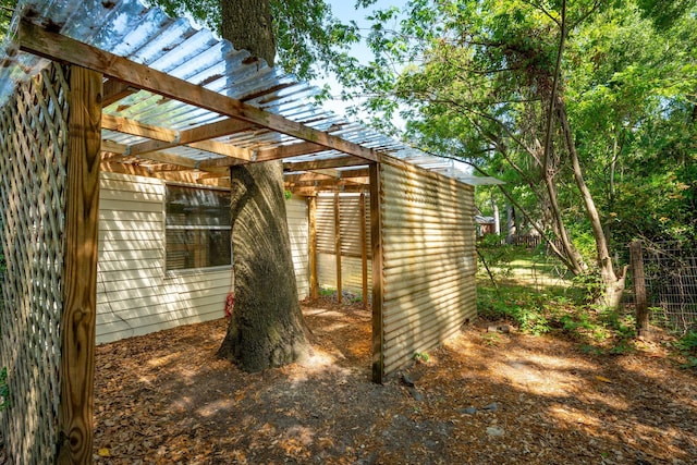 exterior space with fence and a pergola
