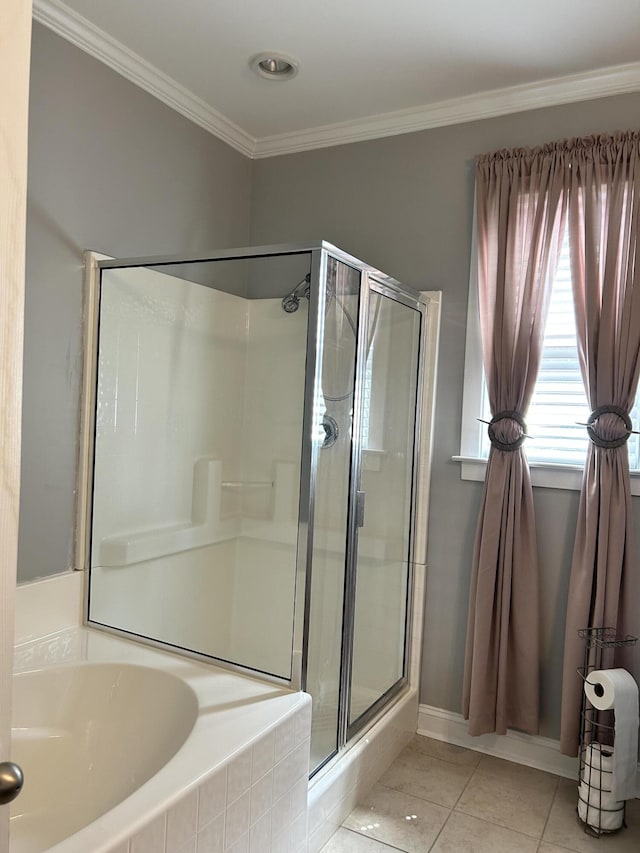 full bath with ornamental molding, baseboards, a shower stall, tile patterned floors, and a bath