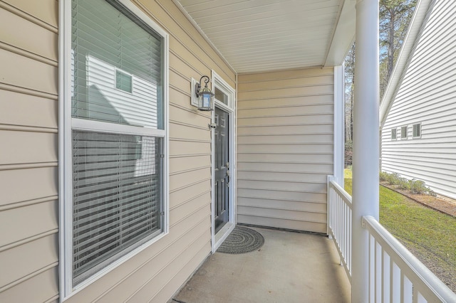 view of exterior entry featuring a porch