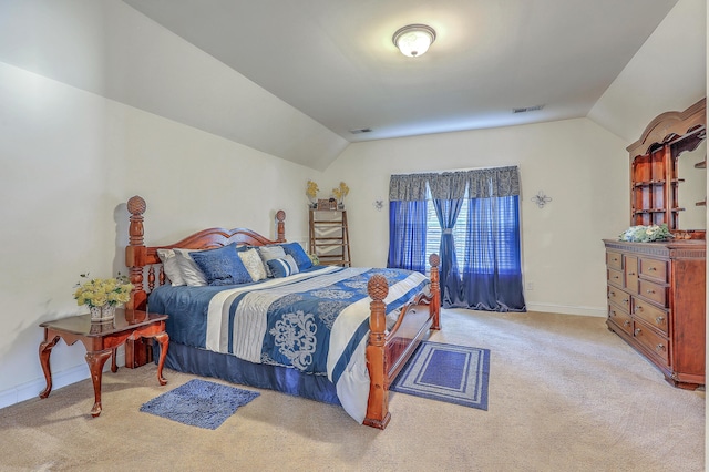 carpeted bedroom with baseboards, visible vents, and vaulted ceiling
