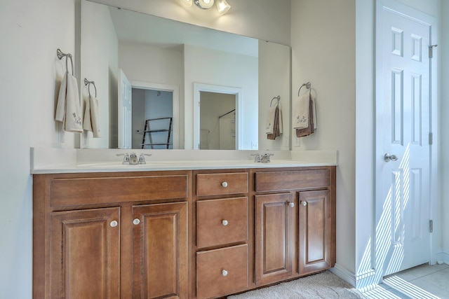 full bathroom featuring double vanity and a sink