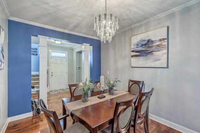 dining space featuring ornamental molding and wood finished floors