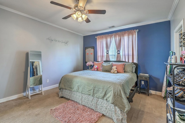 carpeted bedroom with ornamental molding, baseboards, ceiling fan, and visible vents