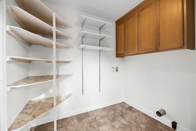 clothes washing area featuring cabinets and washer hookup