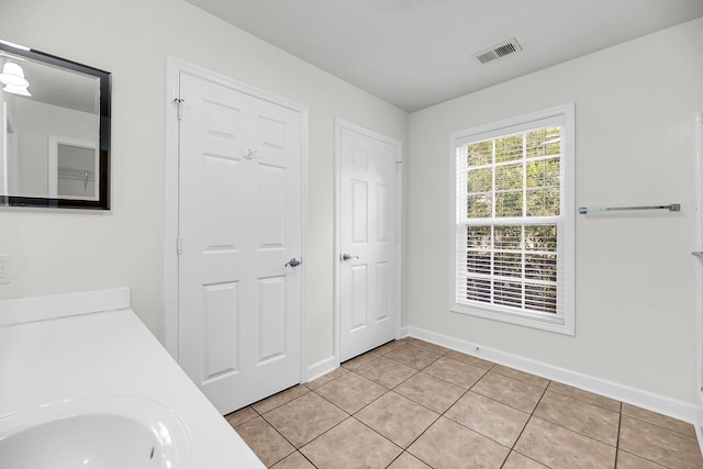 bathroom with tile patterned flooring and sink