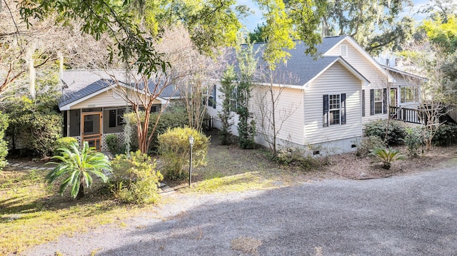 view of side of home with a sunroom