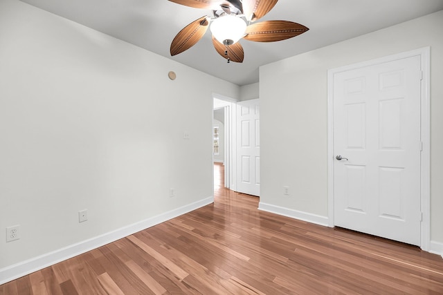 unfurnished bedroom featuring ceiling fan and wood-type flooring