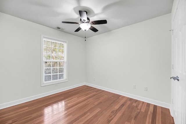 unfurnished room with hardwood / wood-style flooring and ceiling fan