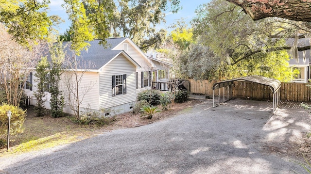 view of property exterior featuring a deck and a carport