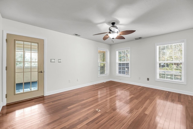 unfurnished room featuring hardwood / wood-style flooring and ceiling fan