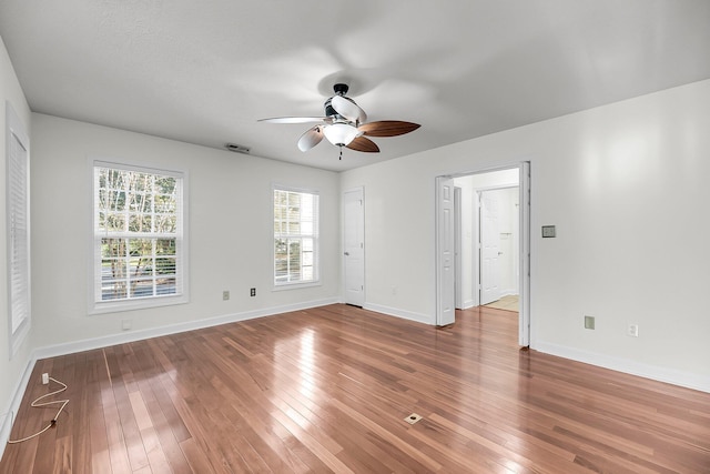 unfurnished room featuring hardwood / wood-style flooring and ceiling fan