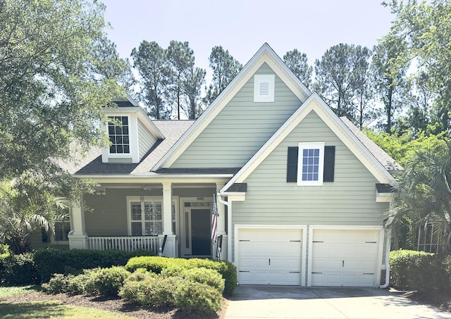 1736 James Basford Pl, Mount Pleasant, SC 29466 - view of front of home featuring concrete driveway, an attached garage, a shingled roof, and covered porch