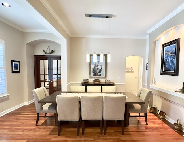 1736 James Basford Pl, Mount Pleasant, SC 29466 - dining area with a healthy amount of sunlight, arched walkways, and wood finished floors