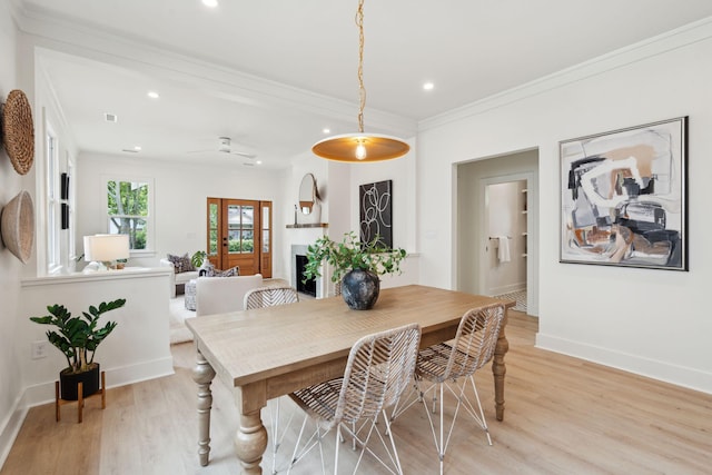4620 Ohear Ave, North Charleston, SC 29405 - dining area with light wood-style floors, ornamental molding, recessed lighting, baseboards, and a fireplace