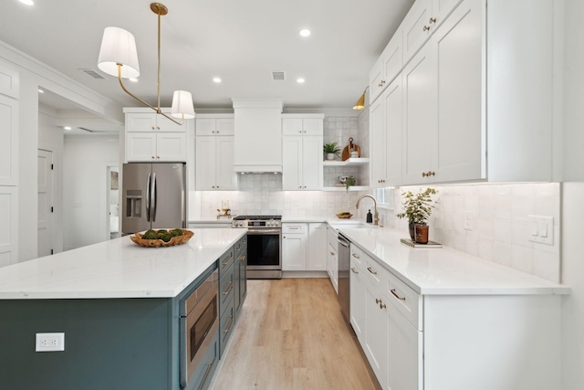 4620 Ohear Ave, North Charleston, SC 29405 - kitchen featuring stainless steel appliances, premium range hood, a sink, white cabinets, and recessed lighting