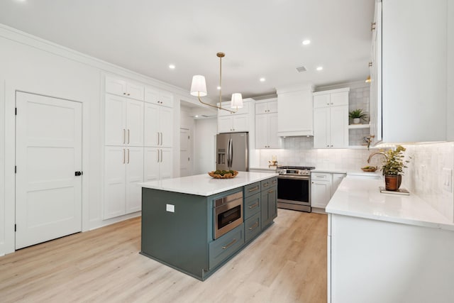 4620 Ohear Ave, North Charleston, SC 29405 - kitchen with stainless steel appliances, a sink, white cabinetry, light wood-style floors, and recessed lighting
