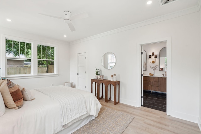 4620 Ohear Ave, North Charleston, SC 29405 - bedroom featuring multiple windows, light wood-type flooring, crown molding, baseboards, and ensuite bathroom