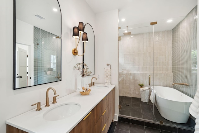 4620 Ohear Ave, North Charleston, SC 29405 - full bathroom with tile patterned floors, a stall shower, double vanity, a freestanding tub, and recessed lighting