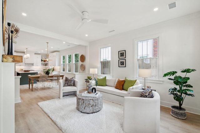 4620 Ohear Ave, North Charleston, SC 29405 - living room featuring crown molding, light wood-type flooring, a ceiling fan, recessed lighting, and baseboards