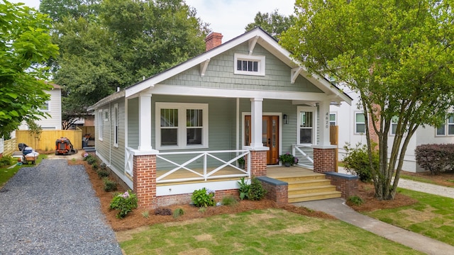 4620 Ohear Ave, North Charleston, SC 29405 - view of front facade with a chimney and covered porch