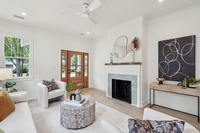 4620 Ohear Ave, North Charleston, SC 29405 - living room featuring ornamental molding, wood finished floors, a tile fireplace, ceiling fan, and recessed lighting