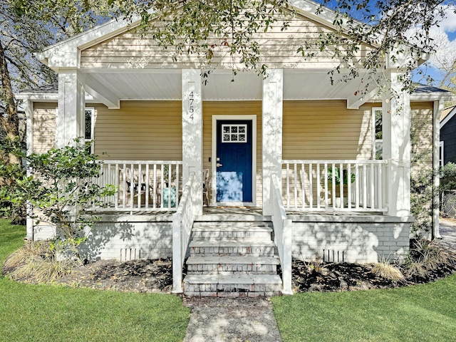 property entrance featuring covered porch