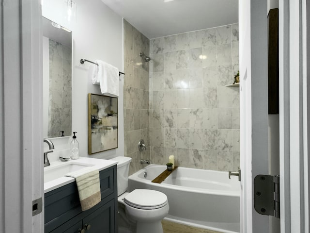 full bathroom featuring toilet, vanity, and shower / bathing tub combination