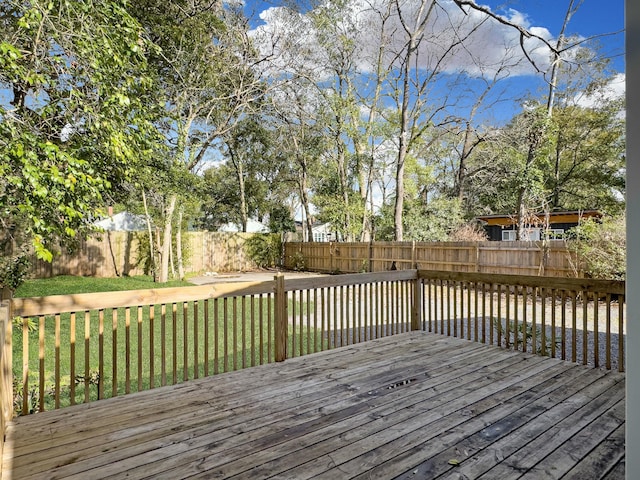 deck featuring a fenced backyard and a yard