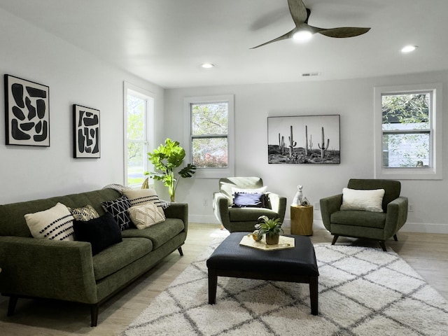 living room with ceiling fan, recessed lighting, wood finished floors, visible vents, and baseboards